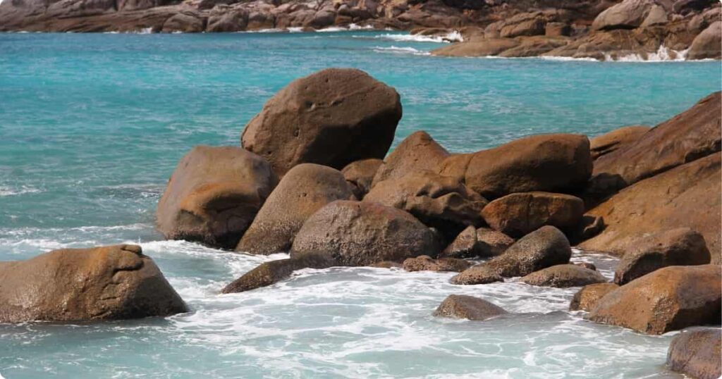 Anse Georgette beach on Praslin island, Seychelles, with dramatic granite boulders and crystal-clear turquoise water