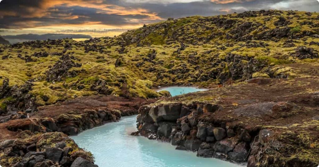 Aerial view of the Blue Lagoon Iceland's milky-blue mineral-rich geothermal water set among black lava fields on the Reykjanes Peninsula