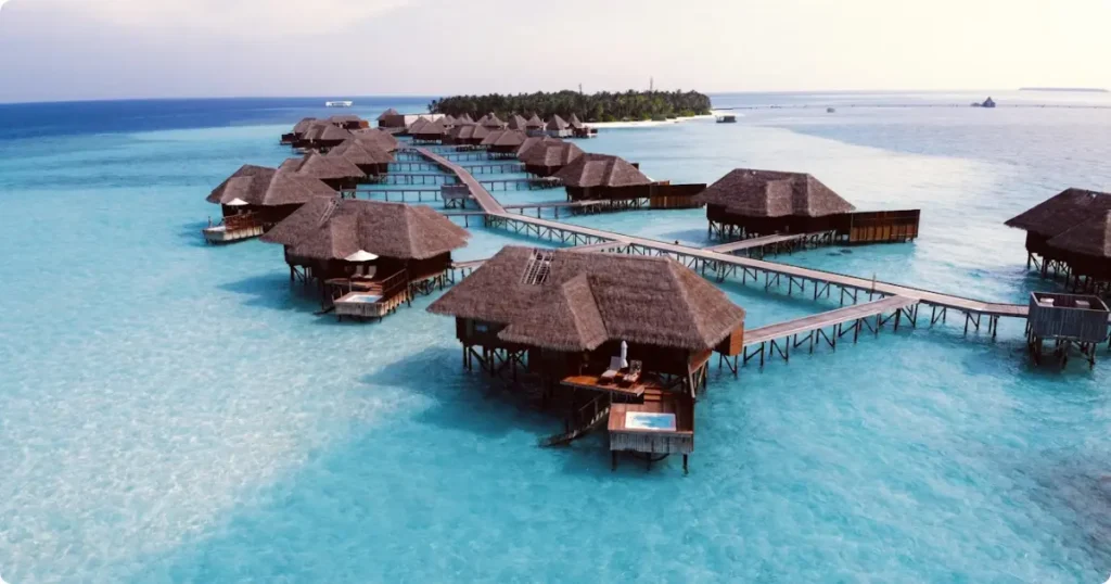 Overwater bungalows in the Maldives at golden hour — complete holiday cost and budget guide