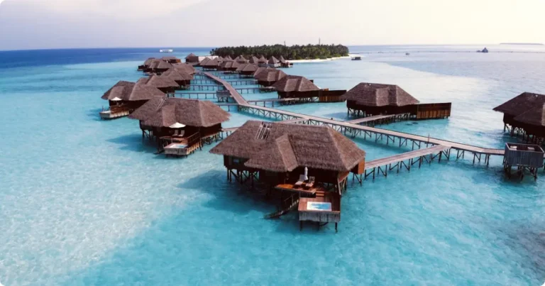 How Much Does a Maldives Holiday Actually Cost? Real Budget Guide Overwater bungalows in the Maldives at golden hour — complete holiday cost and budget guide