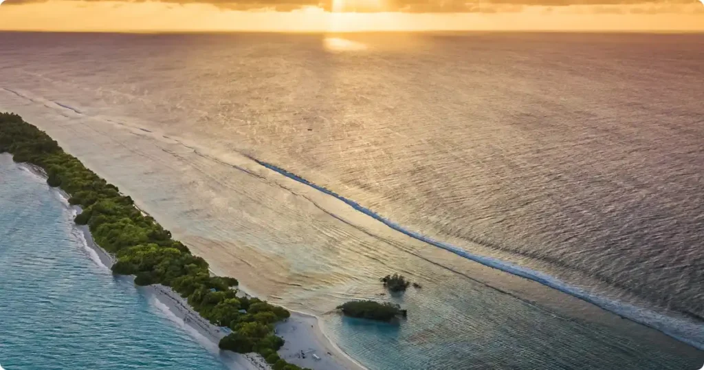 Seaplane flying over Maldives atolls — seaplane transfers add $400–$600 per person to your holiday budget
