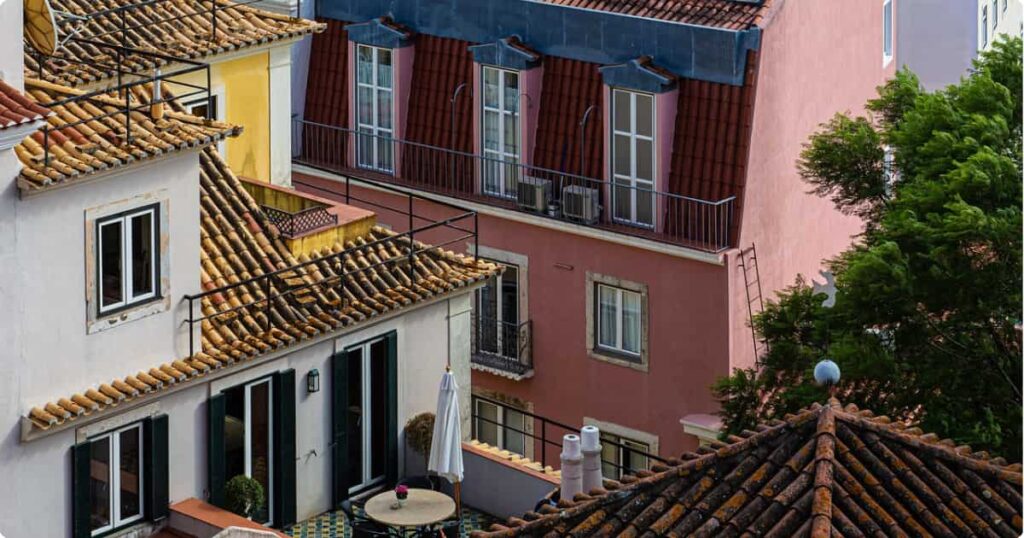 Portugal Travel Guide: Everything USA & UK Travelers Need to Know Portugal travel guide for US and UK travelers — Lisbon rooftops and historic hillside neighborhoods at golden hour