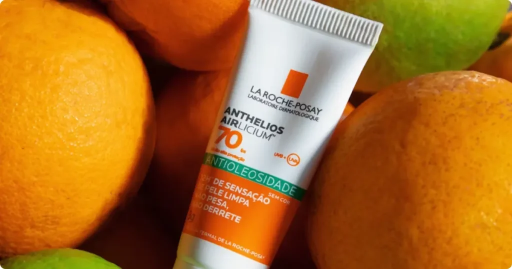 Is Reef Safe Sunscreen Actually Effective? The Real Science Mineral reef safe sunscreen tube held near tropical ocean water with coral reef visible below