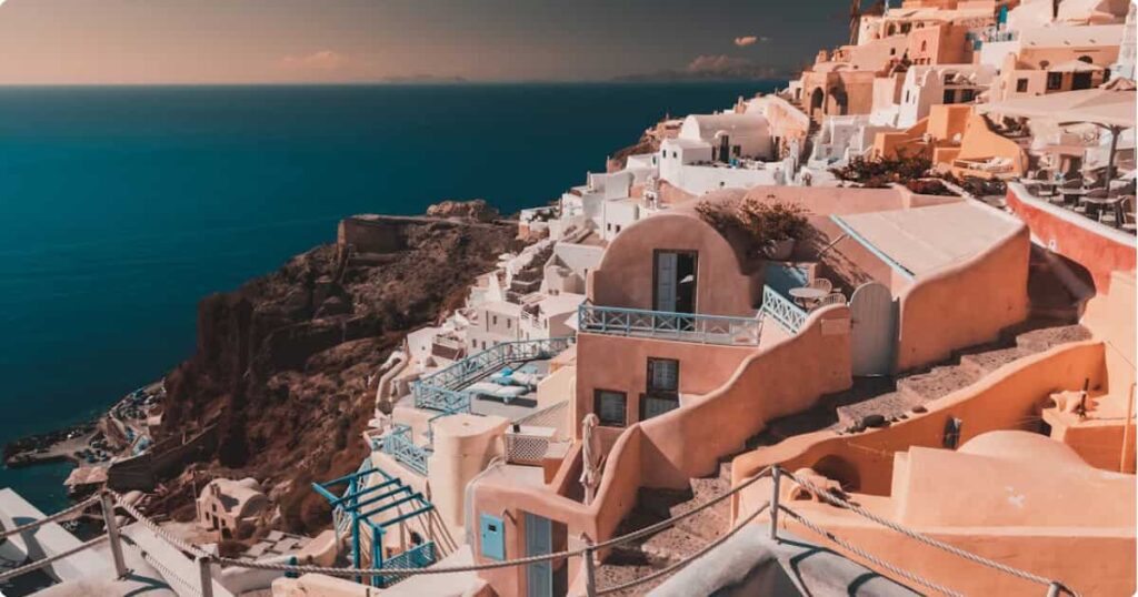 Iconic whitewashed buildings and blue domes of Oia village overlooking the Santorini caldera