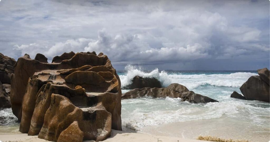 Seychelles Complete Travel Guide for First-Timers Turquoise waters and granite boulders at a Seychelles beach, a perfect first-timer destination in the Indian Ocean