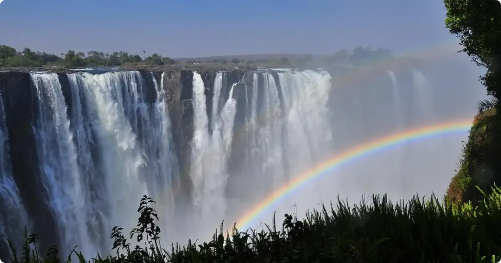  Aerial view of Victoria Falls mist rising over the Zambezi River — adventure travel experiences in Africa