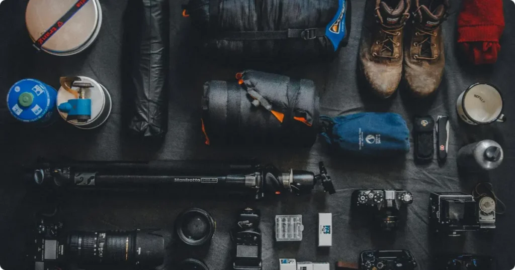 Best travel gear — backpack snorkel mask headphones and dry bag arranged for travel