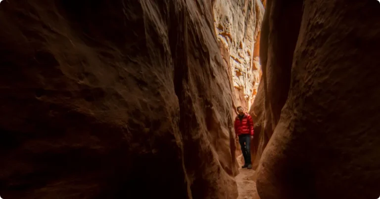 Hiker entering Great Channels Virginia sandstone slot canyon on Brumley Mountain Trail