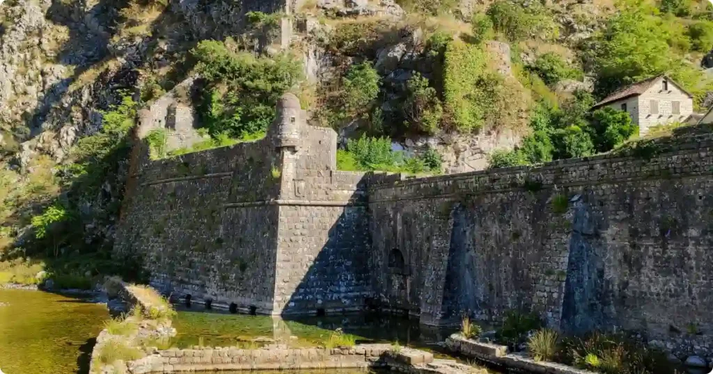 Medieval fortress walls of San Giovanni above Kotor Old Town with Bay of Kotor Montenegro