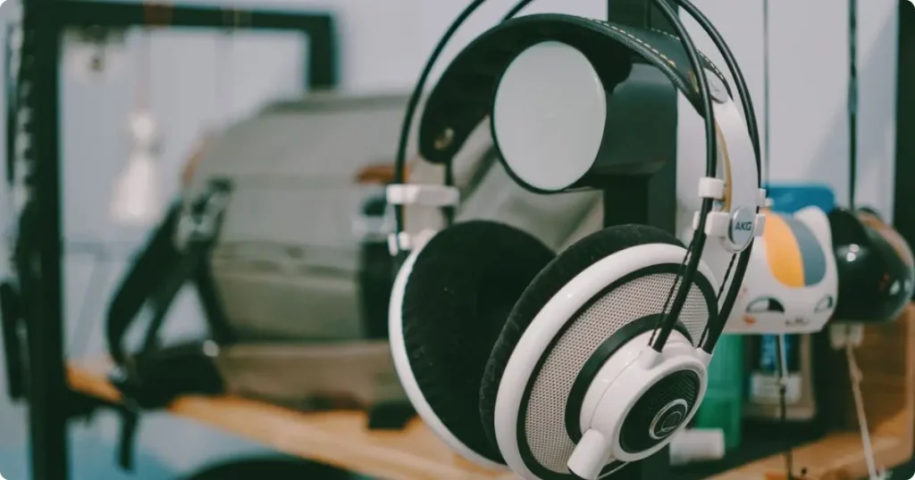 Over-ear noise-cancelling headphone ear cup detail on granite surface showing premium cushion texture