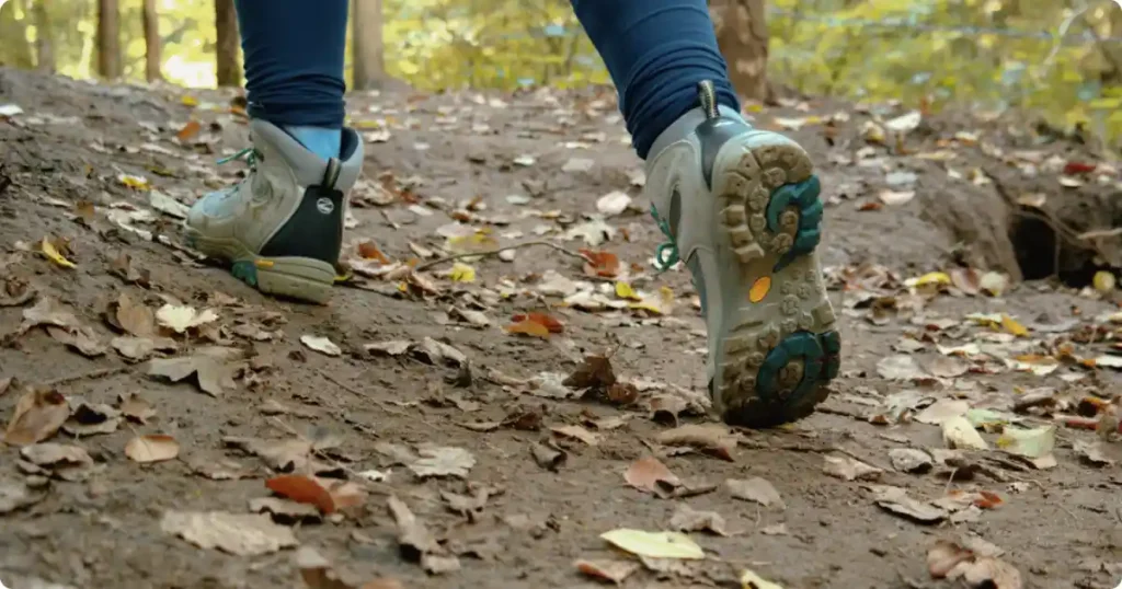 Hiking boots on rocky uneven terrain along Seven Hanging Valleys Trail Portugal