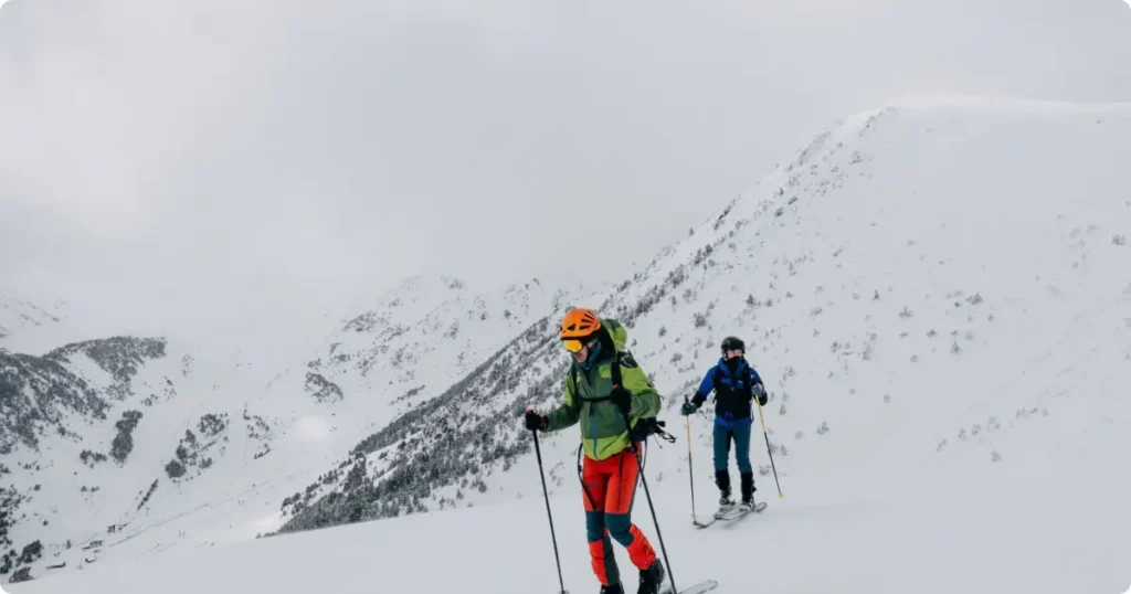 Backcountry ski touring gear on fresh powder snow — sports equipment protection in adventure travel insurance