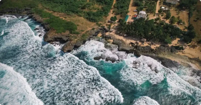Aerial view of turquoise Caribbean coastline showing reef depth and white sand beach, best all-inclusive resorts Caribbean