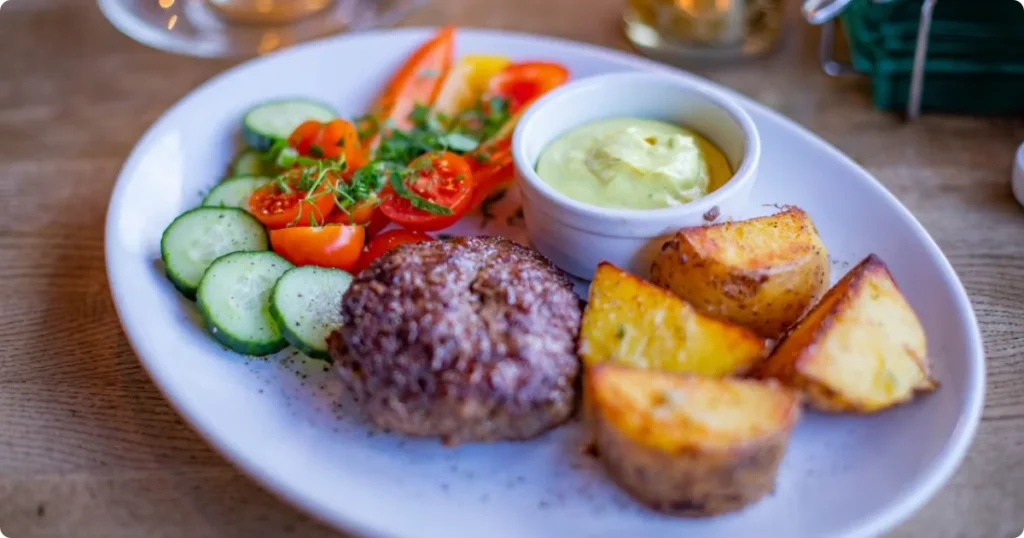 Best food destinations for US and UK travelers Reykjavik Iceland traditional dish on wooden table