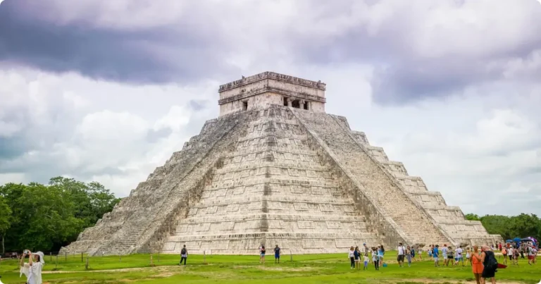 Aerial view of ancient Mayan pyramid rising above jungle canopy in the Yucatan Peninsula, Mexico