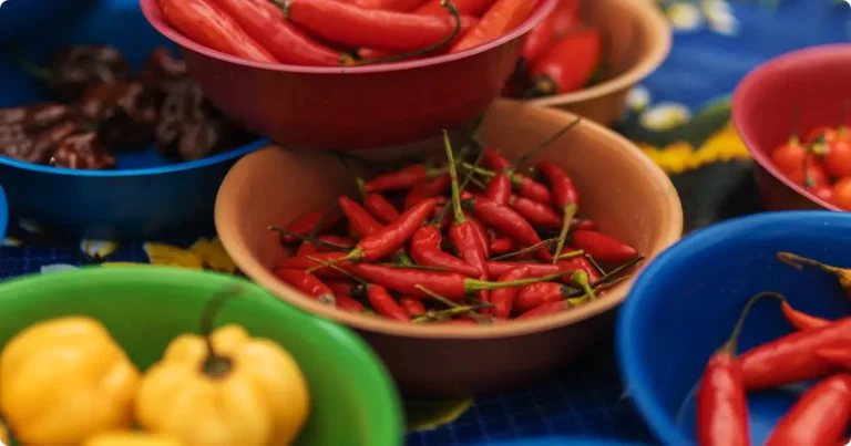 Hands preparing fresh spices and ingredients during a cooking class while traveling in Bali, Oaxaca, or Mexico City
