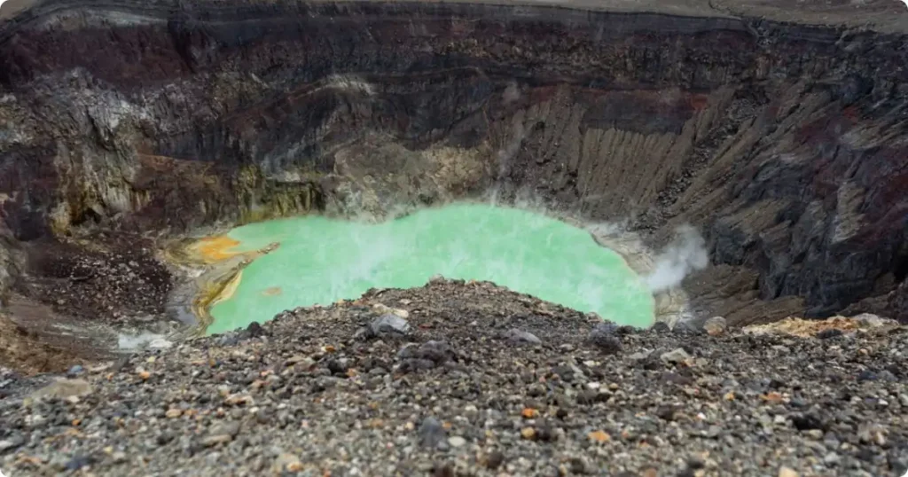 Emerald-green crater lake inside Irazú Volcano, Costa Rica's tallest volcano at 3,432 meters and a top day trip from San José
