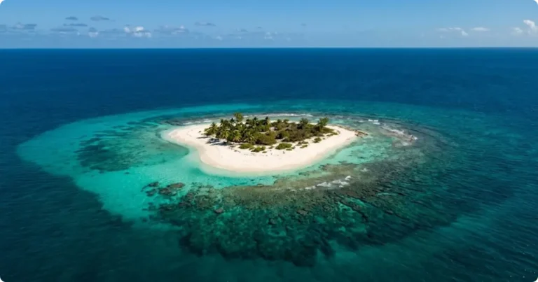 I Spent 10 Days Island-Hopping the USVI on $2,000: Real Trip Report Aerial view of turquoise Caribbean water and white sand beach in the US Virgin Islands