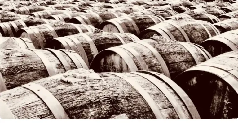 Madeira wine cellar with traditional canteiro wooden barrels in a historic Funchal wine lodge